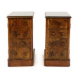 A pair of mahogany and walnut faux drawer bedside cupboards,