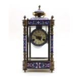 A cast four glass enamelled mantel clock,