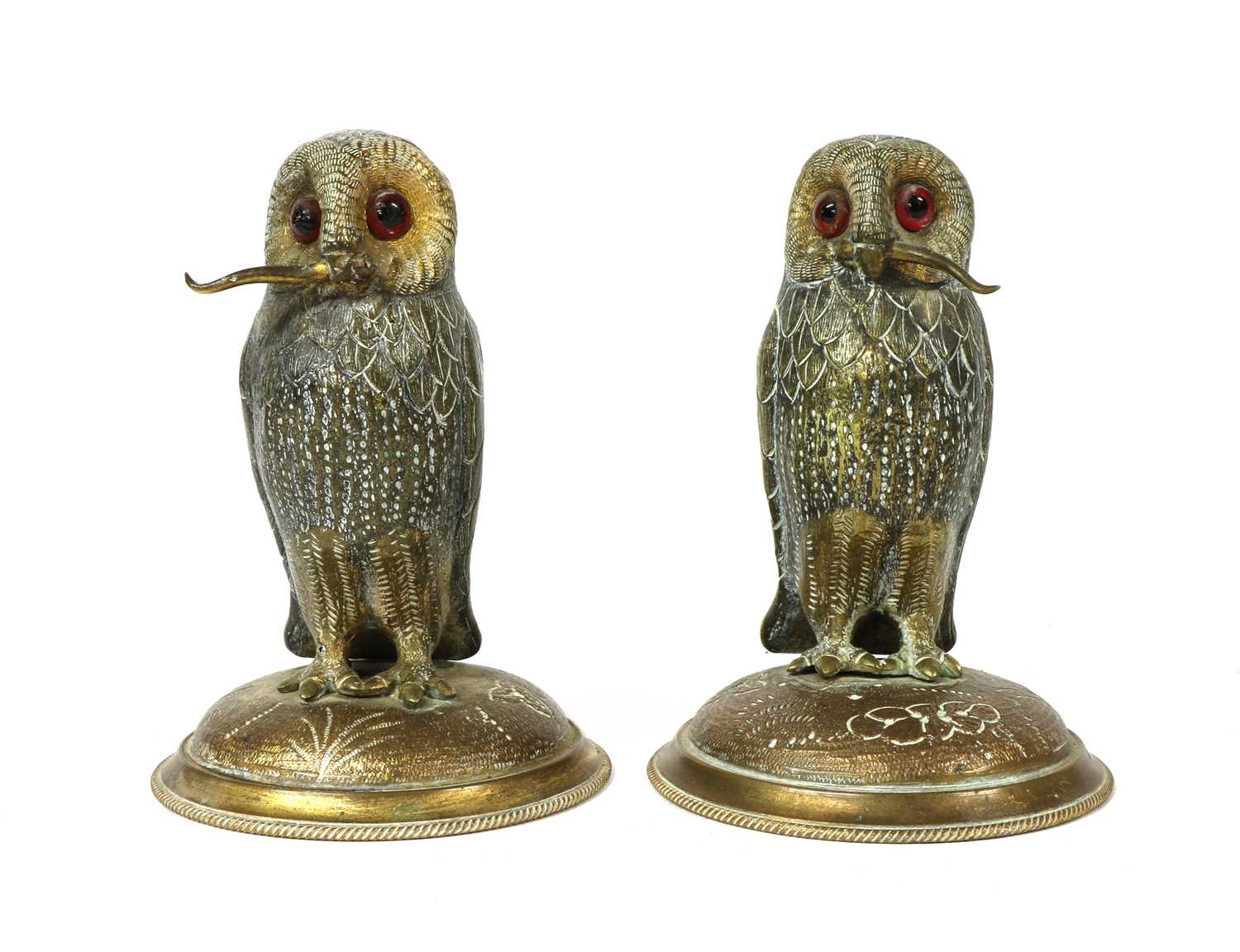 A pair of gilt metal standing owls