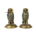 A pair of gilt metal standing owls