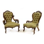 A pair of Victorian walnut armchairs,