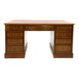 A modern walnut pedestal desk, mid 20th century,