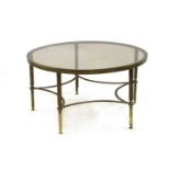 A brass framed coffee table,