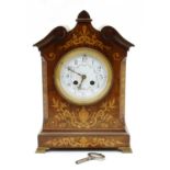 An Edwardian mahogany and inlaid mantle clock,