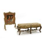 A carved gilt duet stool,