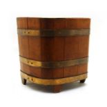 A brass bound coopered oak barrel