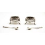 A pair of Victorian silver open salts with spoons