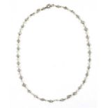 A platinum diamond and seed pearl necklace,