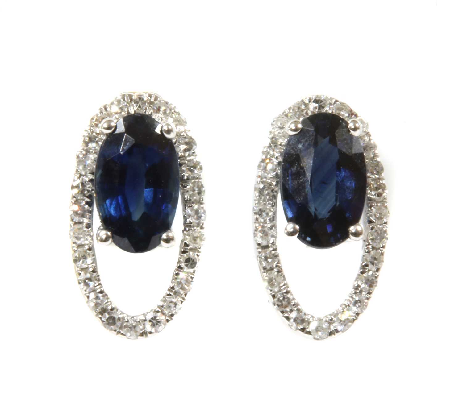 A pair of white gold sapphire and diamond open halo cluster earrings,