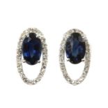 A pair of white gold sapphire and diamond open halo cluster earrings,