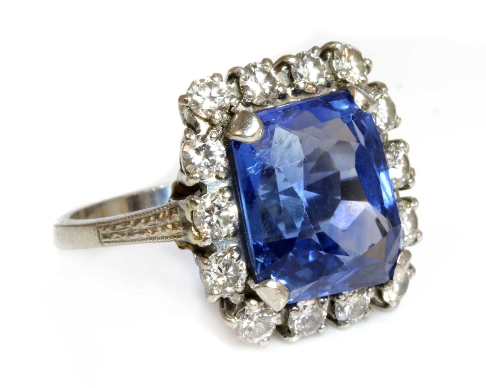 An American sapphire and diamond cushion-shaped cluster ring,