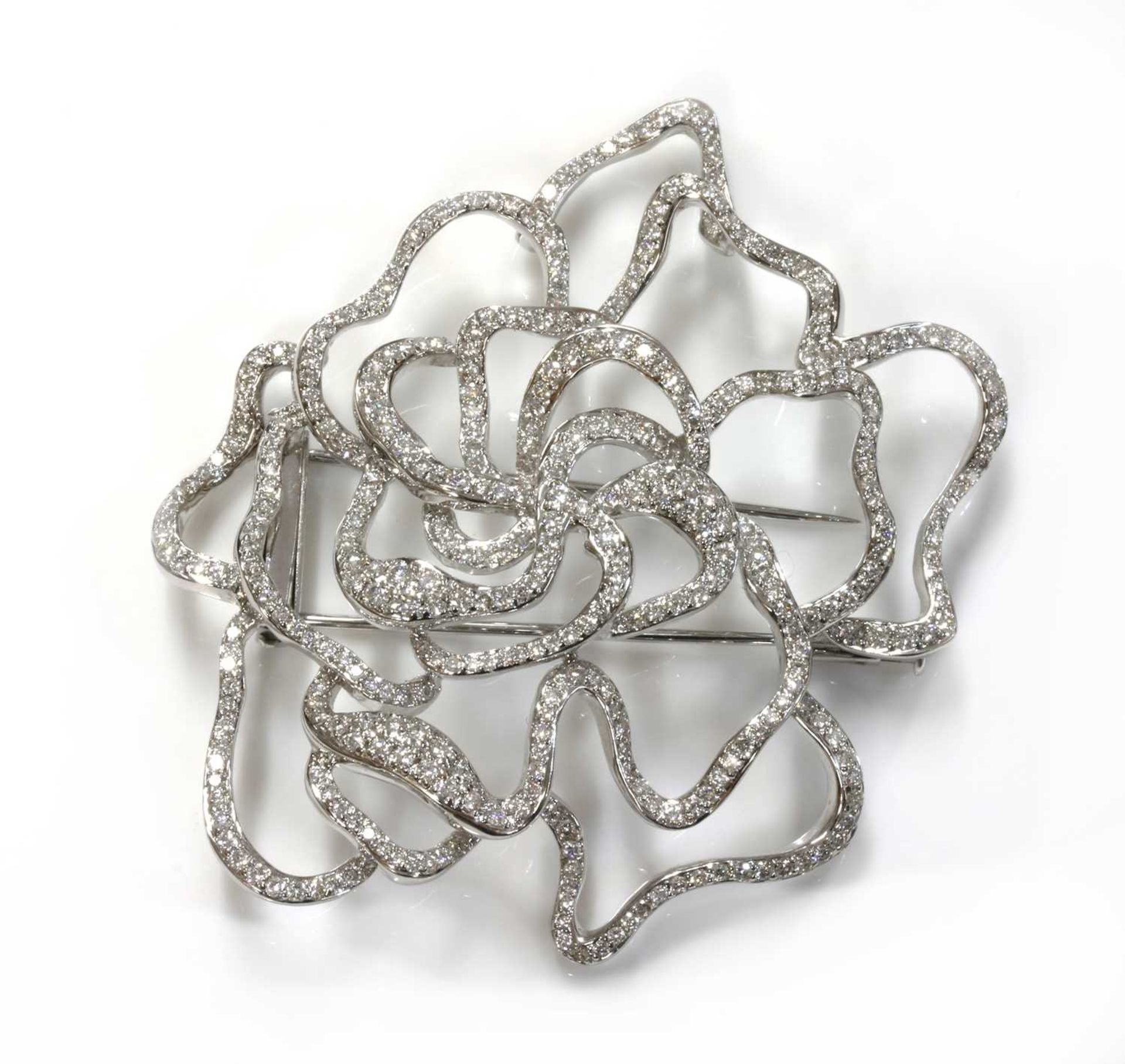 A Continental white gold diamond set ghost rose brooch,