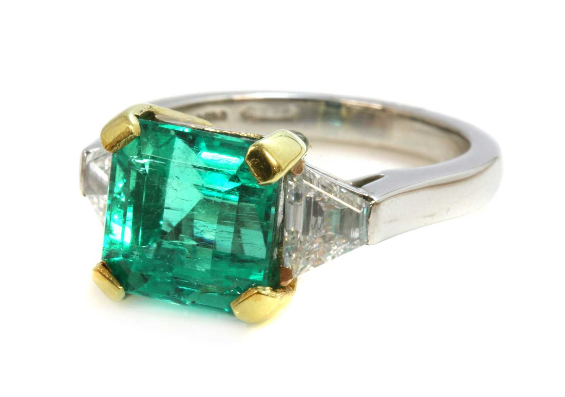 A platinum and gold Colombian emerald and diamond three stone ring, - Image 2 of 4