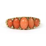 A Victorian gold five stone coral and diamond ring,