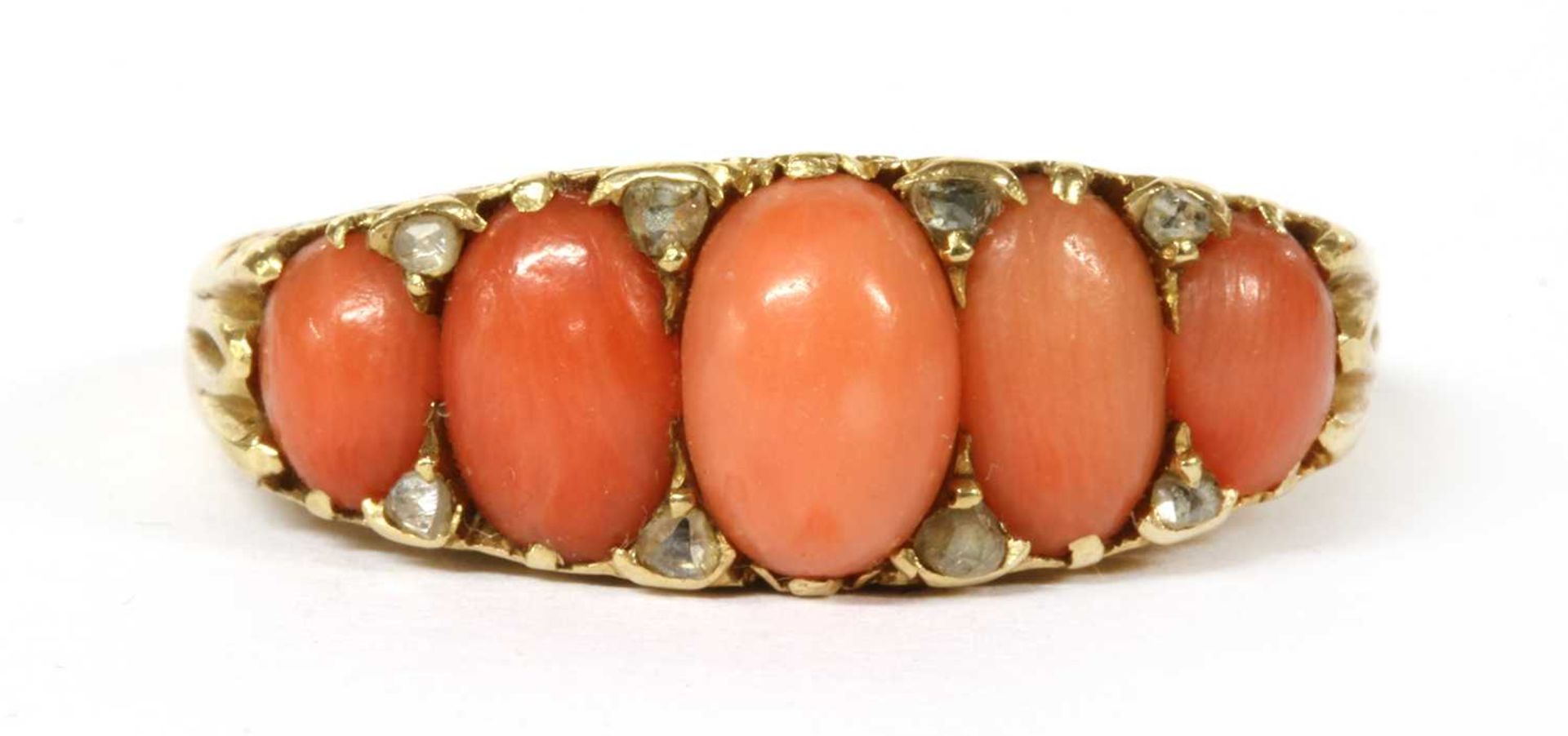 A Victorian gold five stone coral and diamond ring,