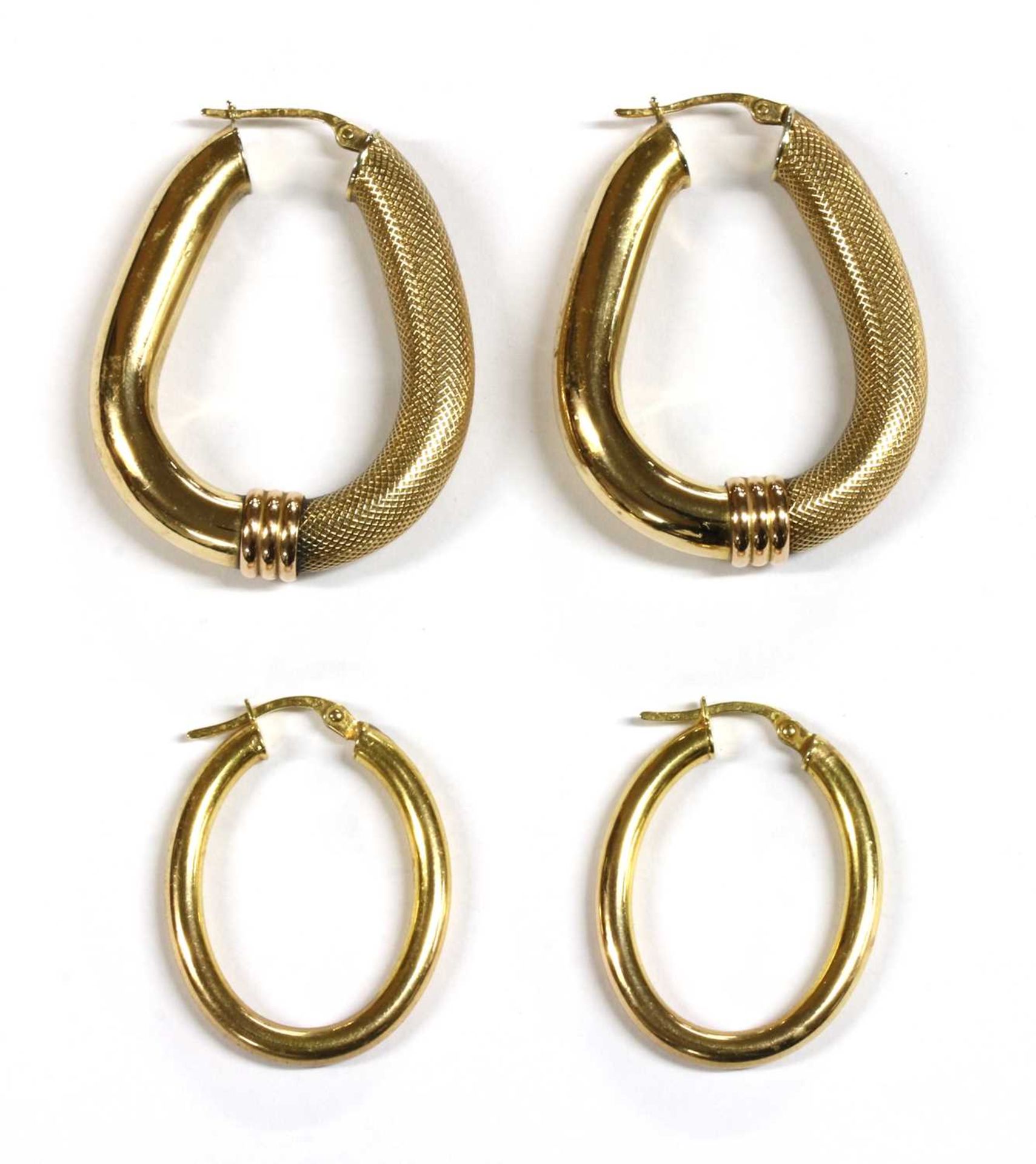 Two pairs of 9ct gold hollow hoop earrings,