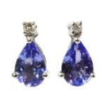 A pair of white gold tanzanite and diamond stud earrings,