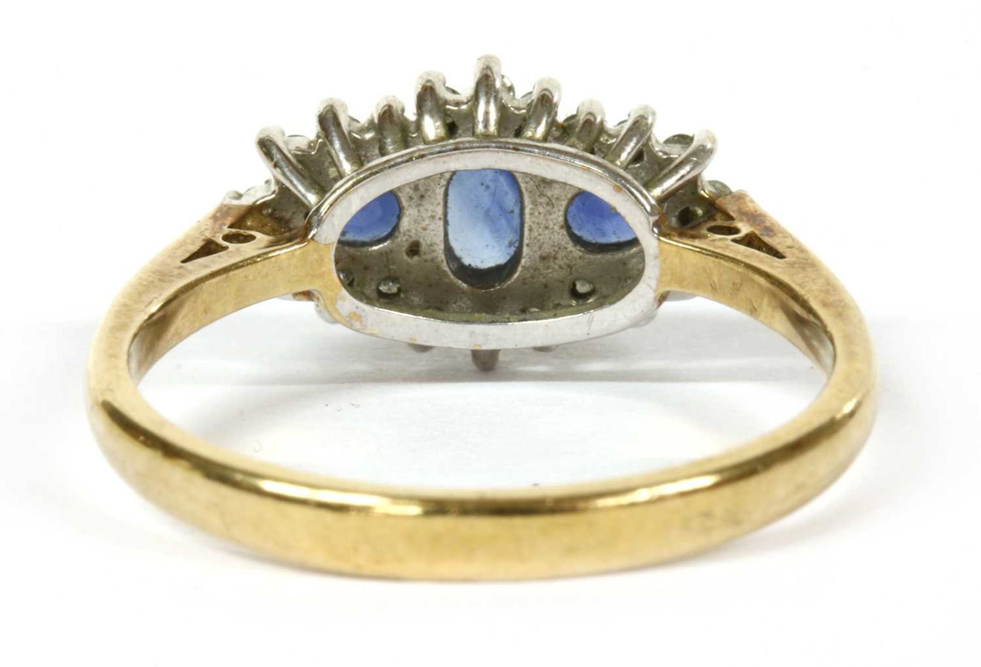 A 9ct gold sapphire and diamond three stone cluster ring, - Image 3 of 4