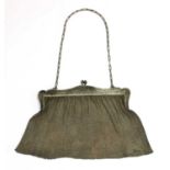 A silver mesh purse,