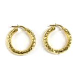 A pair of Italian gold hoop earrings,