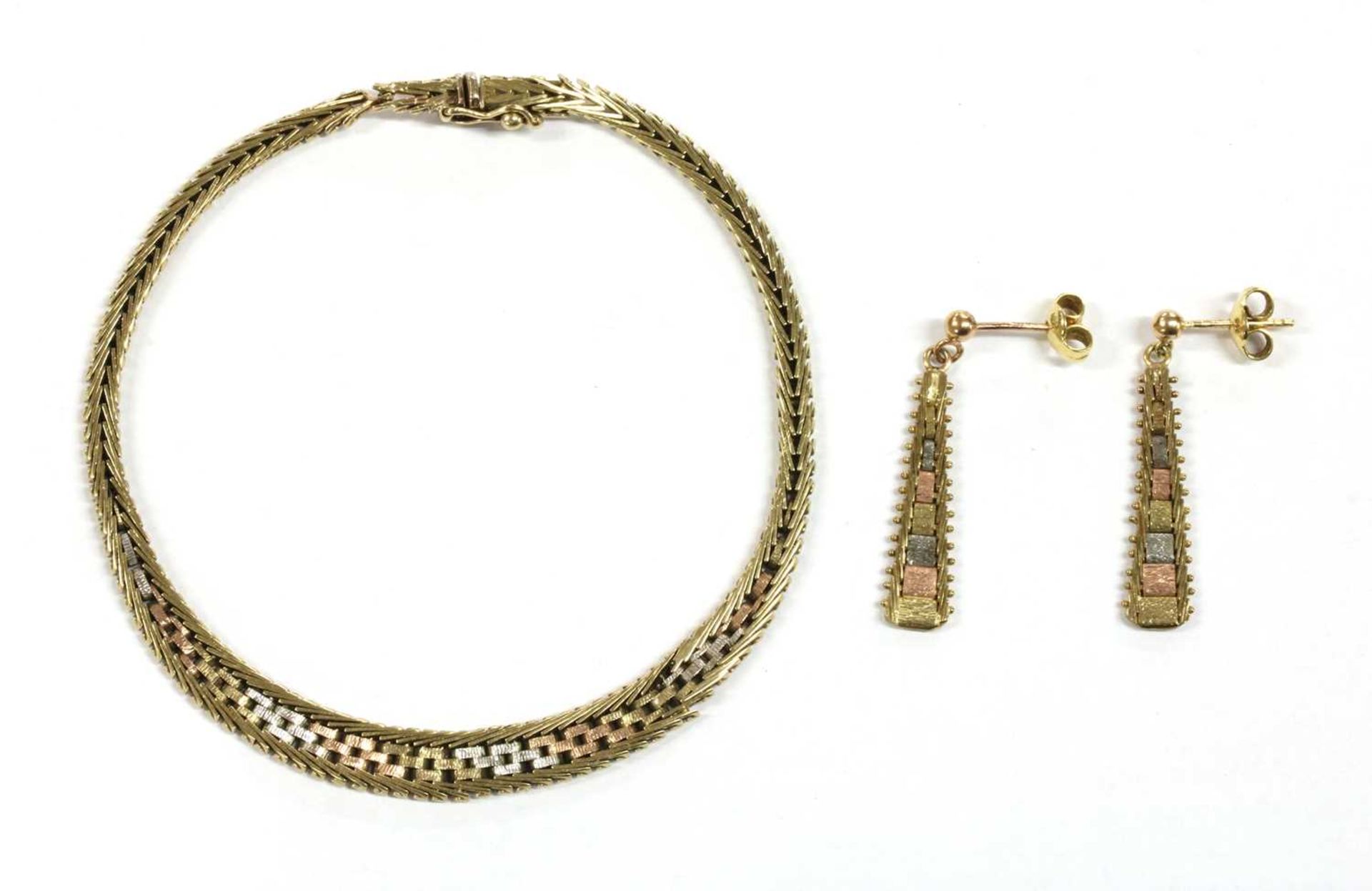 A 9ct three colour gold brick link bracelet and earring suite, c.1980,