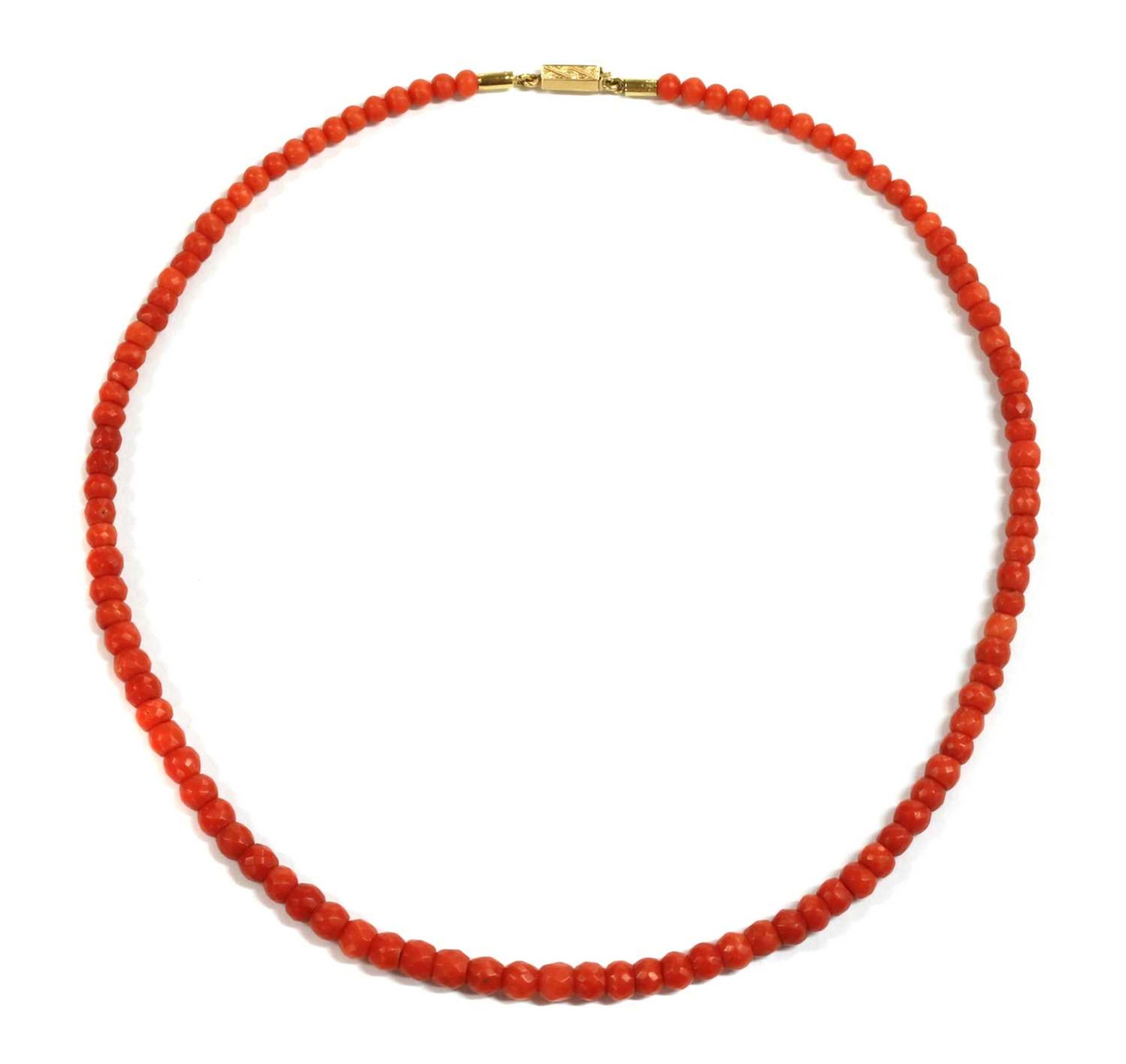 A single row graduated faceted coral bead necklace,
