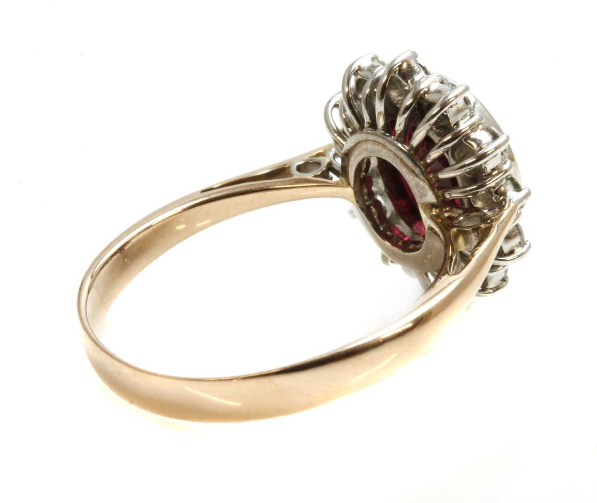 A gold ruby and diamond oval cluster ring, - Image 2 of 4