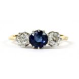 A gold three stone sapphire and diamond ring,