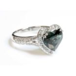 A platinum green sapphire and diamond heart-shaped halo cluster ring,
