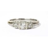 A 9ct white gold three stone diamond ring,