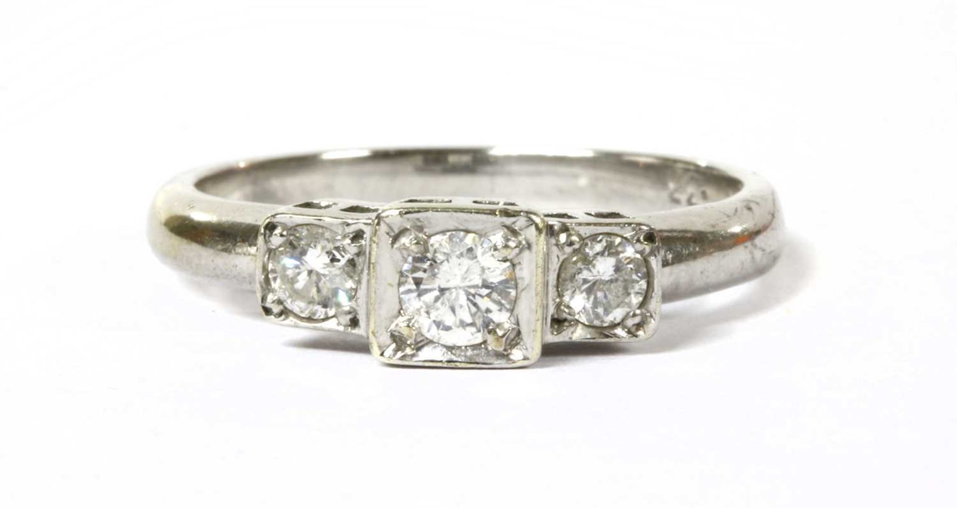 A 9ct white gold three stone diamond ring,