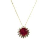 A gold ruby and diamond cluster pendant,