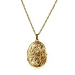 A 9ct gold oval locket,
