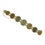 A gilt metal lava stone cameo bracelet,