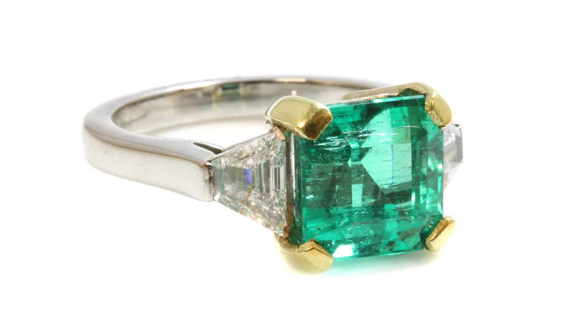 A platinum and gold Colombian emerald and diamond three stone ring, - Image 3 of 4