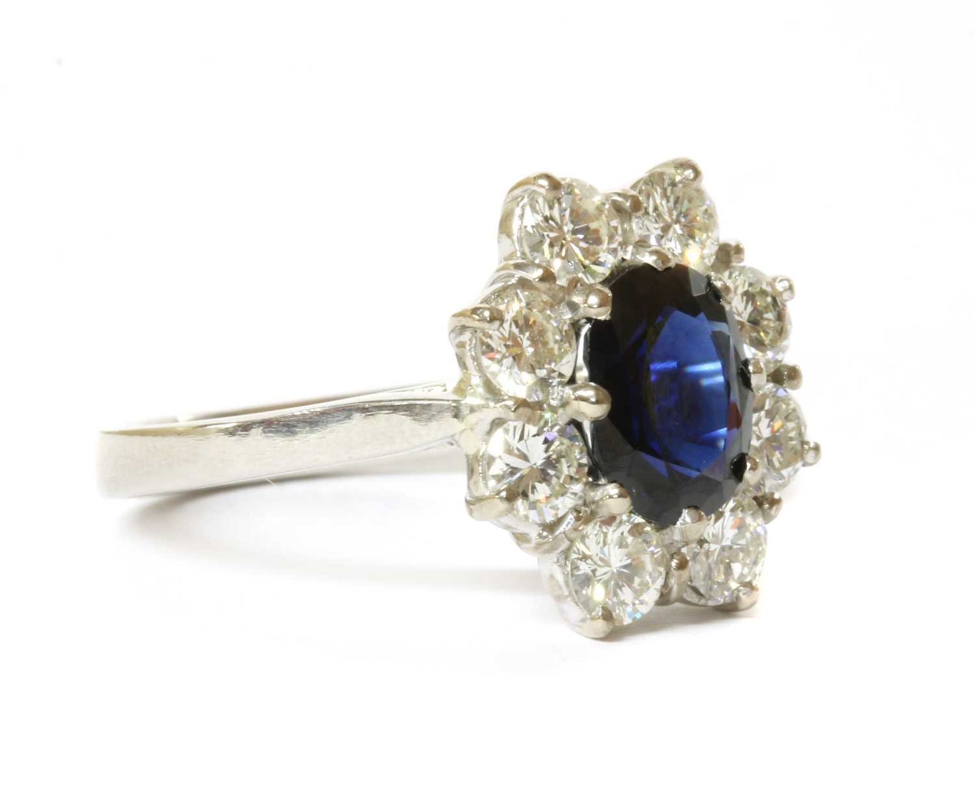 A platinum sapphire and diamond cluster ring, - Image 3 of 4