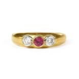 An 18ct gold ruby and diamond three stone ring,