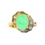 A two colour gold jade and diamond ring,