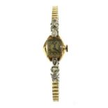 A ladies' gold diamond set mechanical bracelet watch,