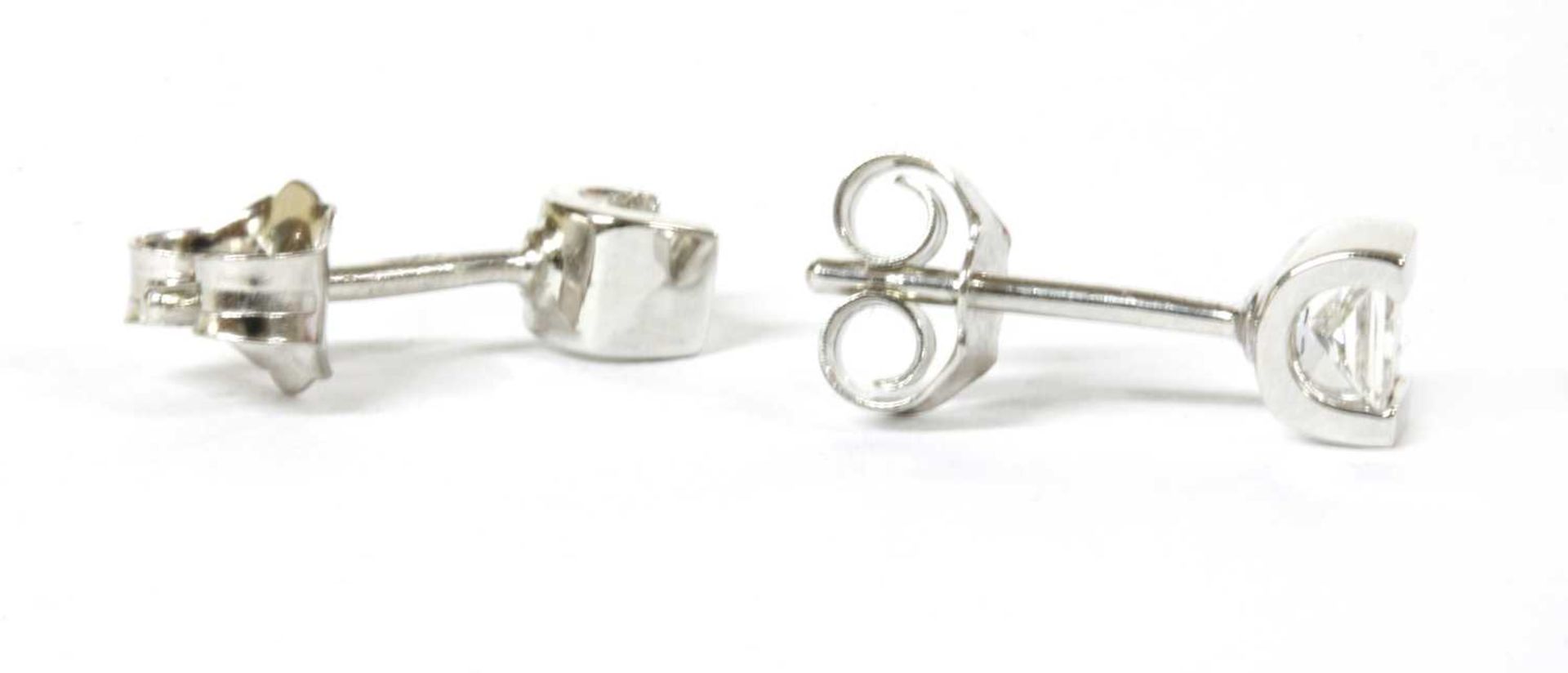 A pair of white gold single stone diamond stud earrings, - Image 2 of 3