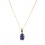 A gold single stone tanzanite pendant,