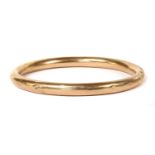 A 9ct gold bangle,