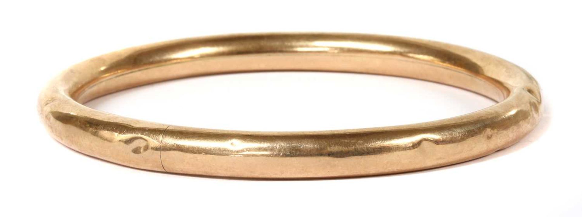 A 9ct gold bangle,