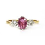 An 18ct gold pink sapphire and diamond three stone ring,