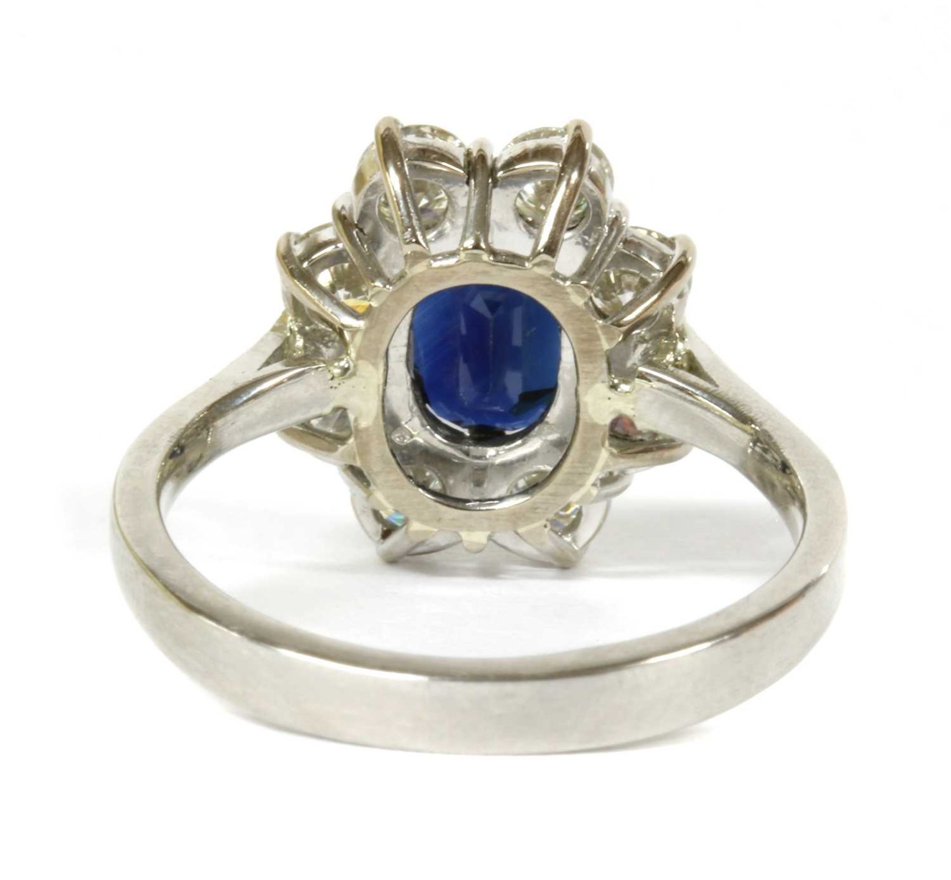 A platinum sapphire and diamond cluster ring, - Image 2 of 4
