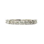 A white gold diamond half eternity ring,