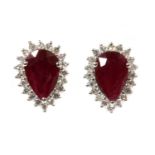 A pair of white gold ruby and diamond halo cluster earrings,