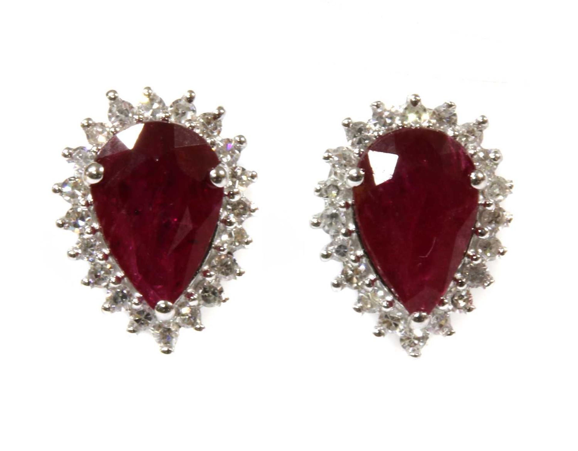 A pair of white gold ruby and diamond halo cluster earrings,