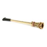 A Dunhill gold cased ruby set cigarette holder,