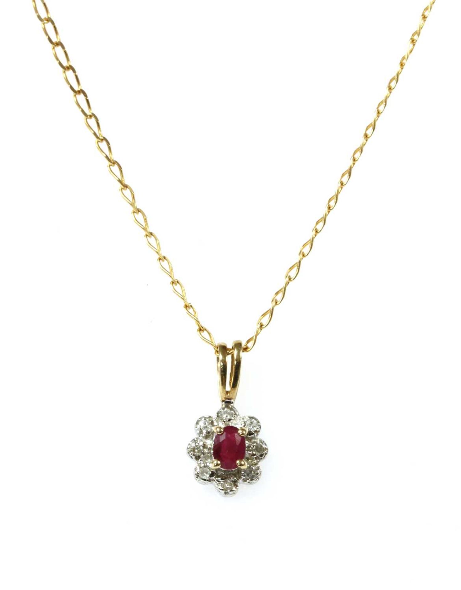 A 9ct gold ruby and diamond cluster pendant,